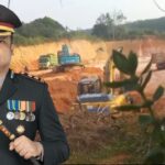 Kapolres Kampar AKBP Boby Putra Ramadhan berlatar gambar lokasi tambang galian C tanpa izin